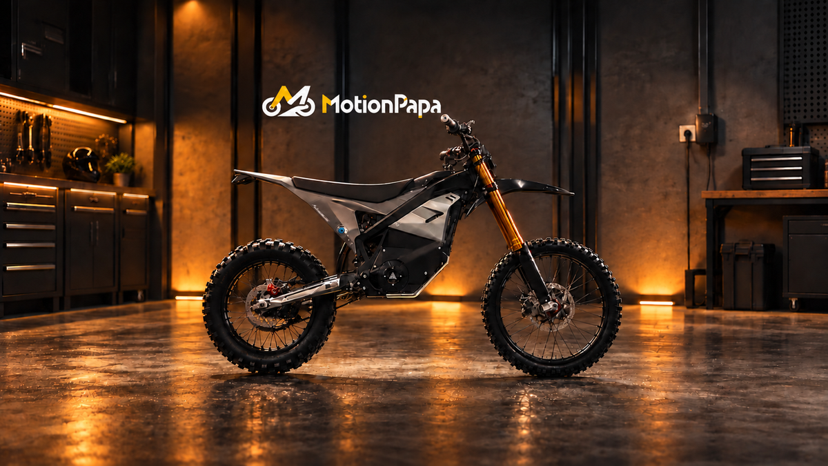 Zmey LA25 dirt e-moto in an amber-lit workshop for a removable-battery ownership guide